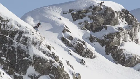 Elite skier speeding down remote mountain summit Stock Footage 113225320