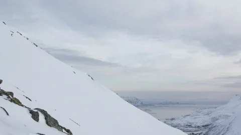 Elite skier speeding down remote mountainside Stock Footage 113226465