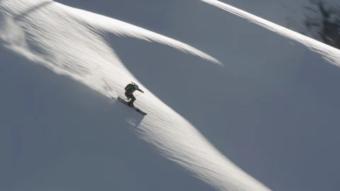 Elite skier speeding through fresh powder on mountain slope Stock Footage 113225888