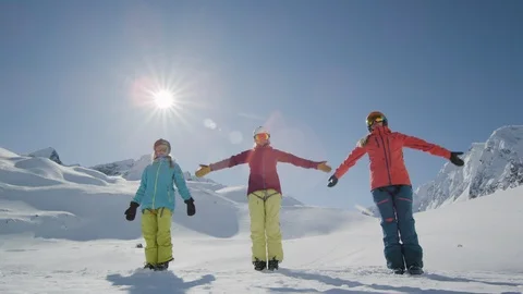 Elite skiers doing yoga on a remote mountain Stock Footage 113259541