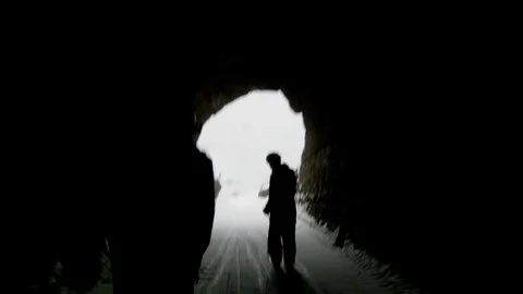Elite skiers skiing through a ski tunnel Stock Footage 113242089