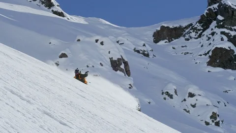Elite snowboarder sliding down snow covered mountain Stock Footage 116748790
