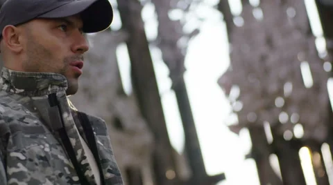 Elite special forces man with a gun training in camp - Steadicam shot at sunset Stock Footage 64372940
