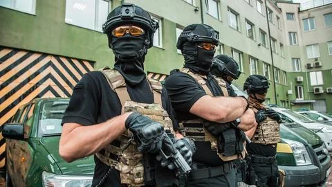 Elite tactical unit ready for operation, fully equipped special forces offi.. Stock Photos