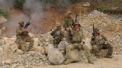 Elite team of special forces soldiers in full tactical gear pose together Stock Footage 342619097