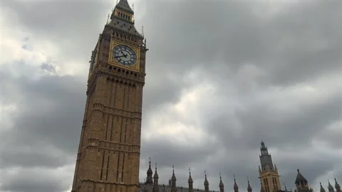 Elizabeth Tower Clock Face Rising Above Parliament Building Stock Footage 338357890
