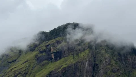 Ella Rock Sri Lanka clouds rolling over mountain peak hill country landscape Stock Footage 334156853