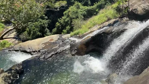Ella, Sri Lanka - march 5th 2025: Man jumps off stunning hidden waterfall Stock-Footage 307862430