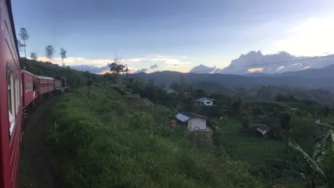 Ella, Sri Lanka, red train against the backdrop of tea plantations Stock Footage 132898199