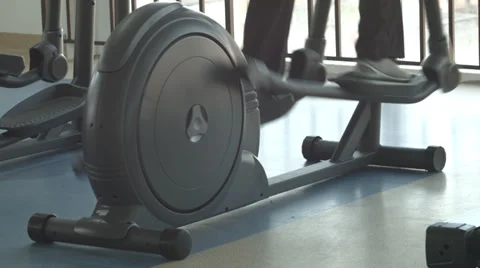 Elliptical exercises in gym Stock Footage 37433140