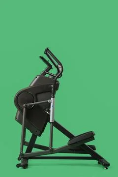 Elliptical machine on green background Stock Photos