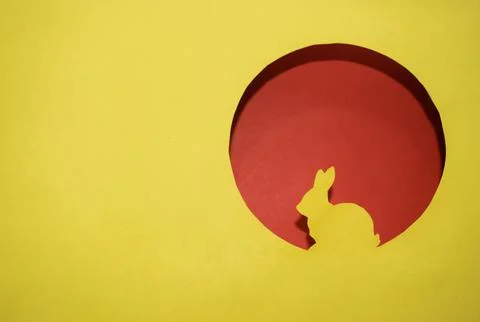 Ellow silhouette of an Easter bunny in a round window Stock-Fotos