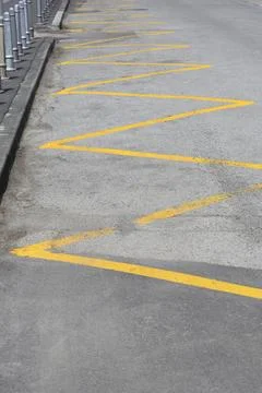 Ellow zig zag lines traffic road marking for bus stop zone Fotos de archivo