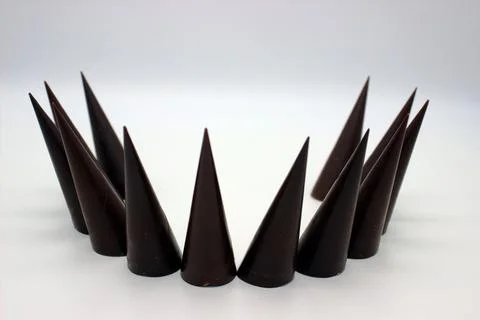 Elongated chocolates on white background Stock Photos