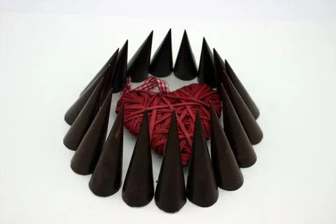 Elongated chocolates on white background Stock Photos