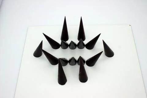 Elongated chocolates on white background Stock Photos