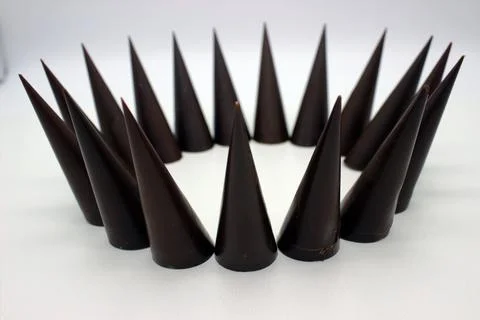 Elongated chocolates on white background Stock Photos