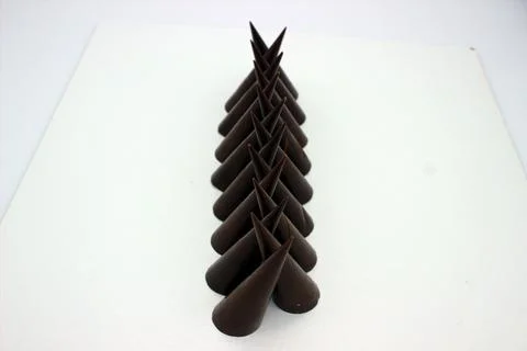 Elongated chocolates on white background Stock Photos