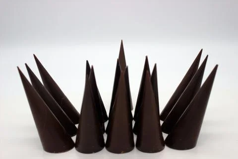 Elongated chocolates on white background Stock Photos
