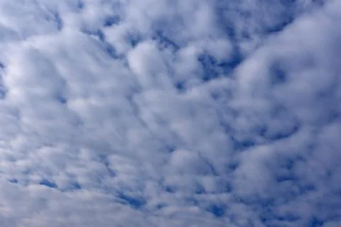 Elongated clouds approaching cloud front . Stock Photos