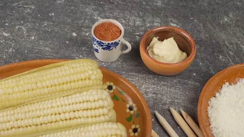 Elotes, Cooked corn to prepare with mayonnaise, Cheese and spicy sauce Stock Footage 280316773
