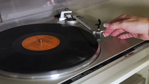 Elvis Vinyl Getting Put On A Record Player Indoors By A Woman Stock Footage 130676737