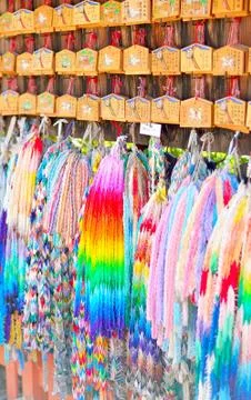 Ema prayer tablets and strings of paper origami cranes. Stock Photos