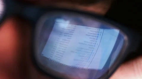 Email list reflected in man's glasses Stock Footage 61705701