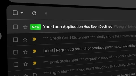 Email notification showing a declined loan application message on screen. 库存影片 334380573