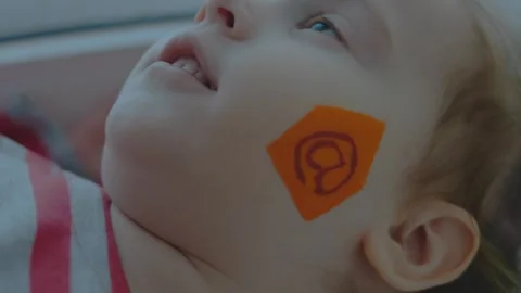 Email symbol painting on the face of a cute toddler girl. Communication concept. Stock Footage 257582503