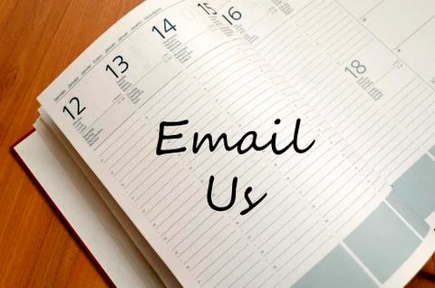 Email us write on notebook Stock Photos