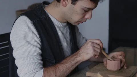 Embark on a captivating journey into the world of a skilled Latino artisan Stock Footage 258567014