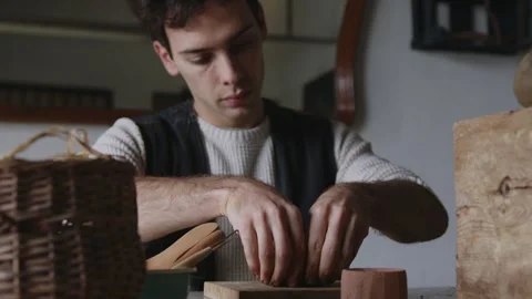Embark on a captivating journey into the world of a skilled Latino artisan Stock Footage 259063063