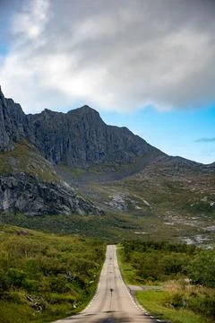 Embark on an epic journey with this captivating image of a remote mountain ro Stock Photos