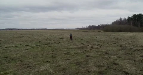 Embarking on an exhilarating adventure to explore expansive open fields on a Stock Footage 310514126