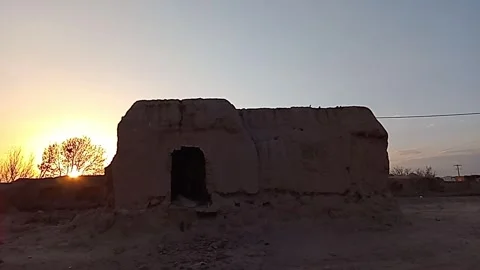 Embered Canvas A Thatched Half- Ruin at Sunset Stock Footage 270937001