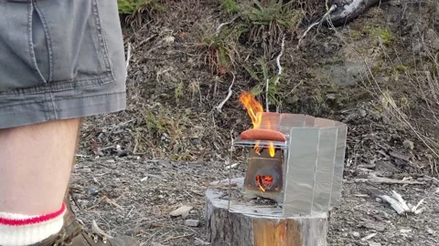 Emberlit Stove- putting on smokies Stock Footage 190836948