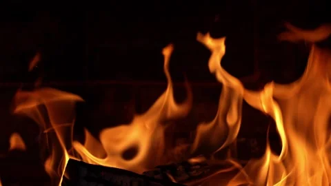 Embers Dance in Golden Flames Within a Rustic Hearth Stock Footage 344877592