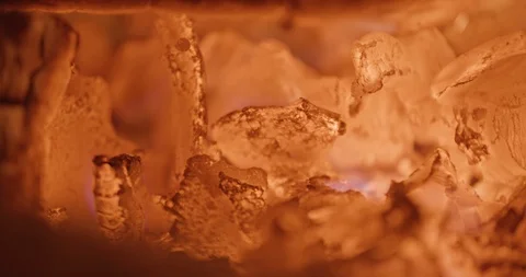 Embers flicker in foreground in slow motion Stock Footage 102789568