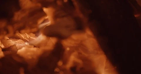 Embers flicker on frame right in slow motion Stock Footage 102787864
