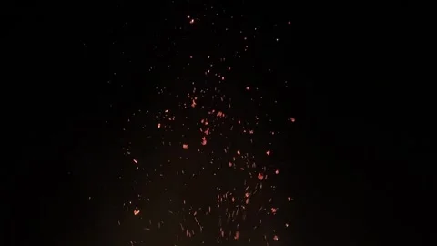 Embers floating upwards into the dark night sky. Stock Footage 333699955
