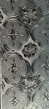 Embossed Glassy Metallic Pattern with Circular Motifs Stock Photos