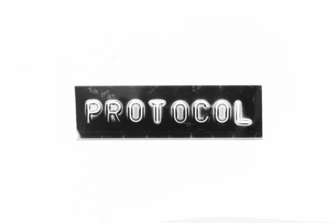 Embossed letter with word protocol in black banner on white paper background 写真素材