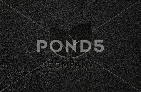 Embossed logo mockup on black background PSD Template