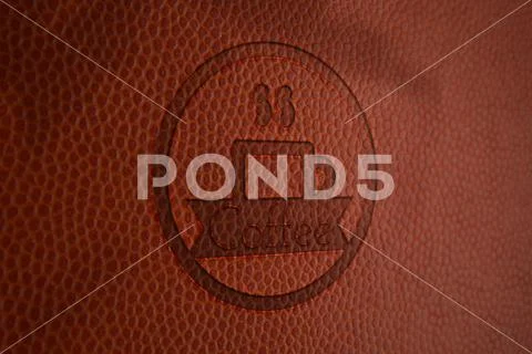 Embossed logo mockup on brown leather textured background PSD Template