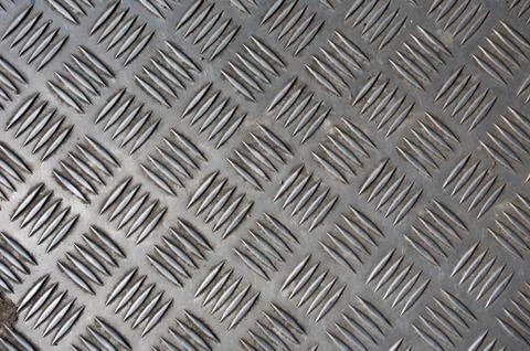Embossed metal abstract pattern texture background Stock Photos