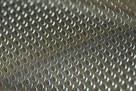 Embossed Metallic Surface with Oval Pattern Close-Up Stock Photos
