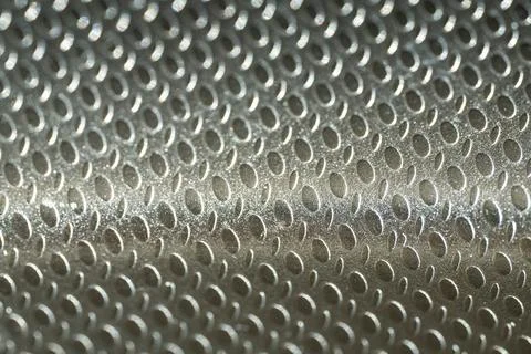 Embossed Metallic Surface with Oval Pattern Close-Up Stock Photos