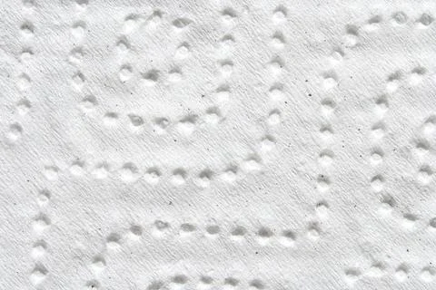 Embossed paper texture with geometric patterns in white close up Stock Photos