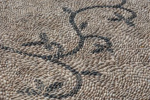 Embossed paving of pavement from stones with patterns Stock Photos